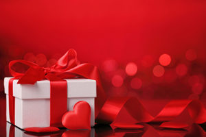 Valantines Present. White Box with red hearts and ribbon