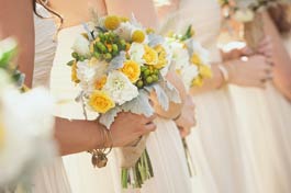 Bridesmaids in a line with posies