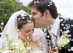 Bride and groom covered in confetti 