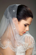 Bride withnet and lace veil