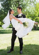 Groom carrying the bride