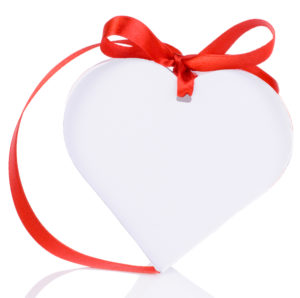 White heart box tied with red ribbon